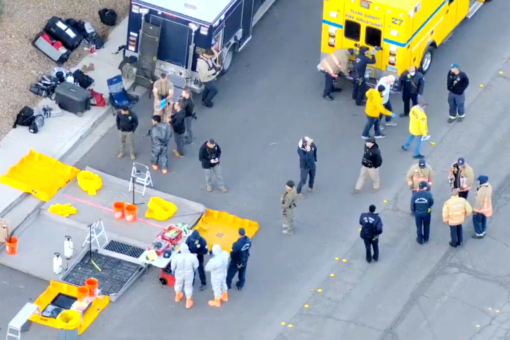 This image made from video provided by the Las Vegas Metropolitan Police Department shows law enforcement conducting a search at a house in Las Vegas, Saturday, Jan. 31, 2026, in Las Vegas. (LVMPD via AP)