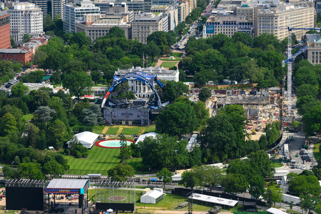 Workers continue building the stage for a future UFC fight on the South Lawn of the White House, center, Tuesday, June 9, 2026, in Washington, as work also continues on the construction of the ballroom, right. (AP Photo/Cliff Owen)