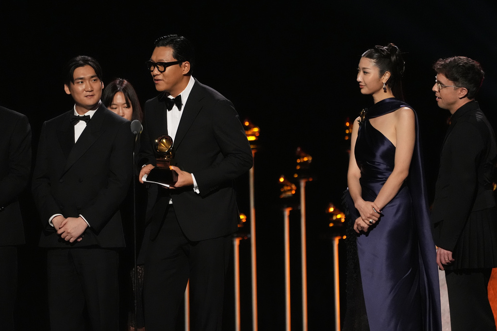 The team from KPop Demon Hunters accept the award for best song written for visual media for "Golden" during the 68th annual Grammy Awards on Sunday, Feb. 1, 2026, in Los Angeles. (AP Photo/Chris Pizzello)