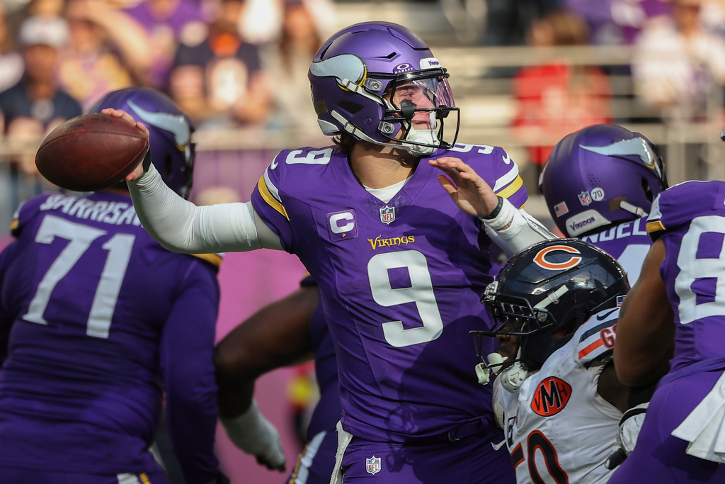 Minnesota Vikings quarterback J.J. McCarthy (9) throws during the first half of an NFL football game against the Chicago Bears, Sunday, Nov. 16, 2025, in Minneapolis. (AP Photo/Matt Krohn)