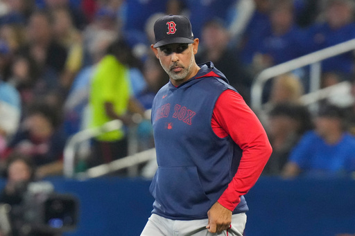 Boston Red Sox manager Alex Cora walks onto the field to relieve Red Sox pitcher Brayan Bello during sixth inning MLB baseball action against the Toronto Blue Jays in Toronto on Thursday Sept. 25, 2025. (Chris Young/The Canadian Press via AP) Boston Red Sox manager Alex Cora walks onto the field to relieve Red Sox pitcher Brayan Bello during sixth inning MLB baseball action against the Toronto Blue Jays in Toronto on Thursday Sept. 25, 2025. (Chris Young/The Canadian Press via AP)