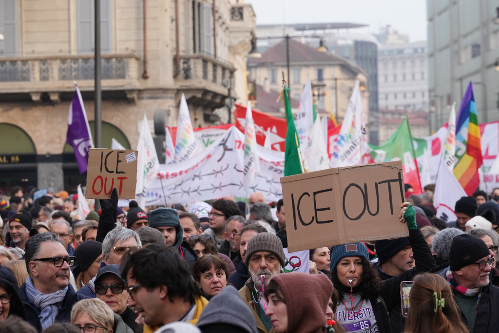 People take part in an Anti-ICE demonstration, ahead of the 2026 Winter Olympics, in Milan, Italy, Saturday, Jan. 31, 2026. (AP Photo/Antonio Calanni)
