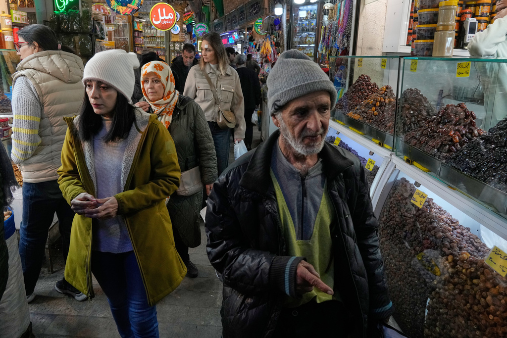 People walk through the Tajrish bazaar market in northern Tehran, Iran, Tuesday, Jan. 27, 2026. (AP Photo/Vahid Salemi)
