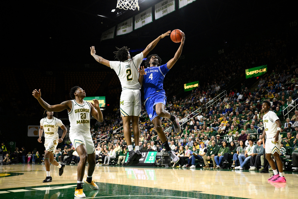 Saint Louis guard Amari McCottry (4) goes to the basket against George Mason guard Jahari Long (2) and forward Nick Ellington (23) during the first half of an NCAA college basketball game, Saturday, March 7, 2026, in Fairfax, Va. (AP Photo/Nick Wass)