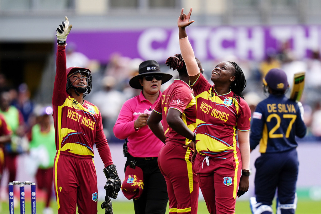 West Indies' Aaliyah Alleyne, right, celebrates taking the wicket of Sri Lanka's Kavisha Dilhari during the ICC Women's T20 World Cup match between Sri Lanka and West Indies, in Manchester, England, Sunday, June 21, 2026. ( Jacob King/PA via AP)