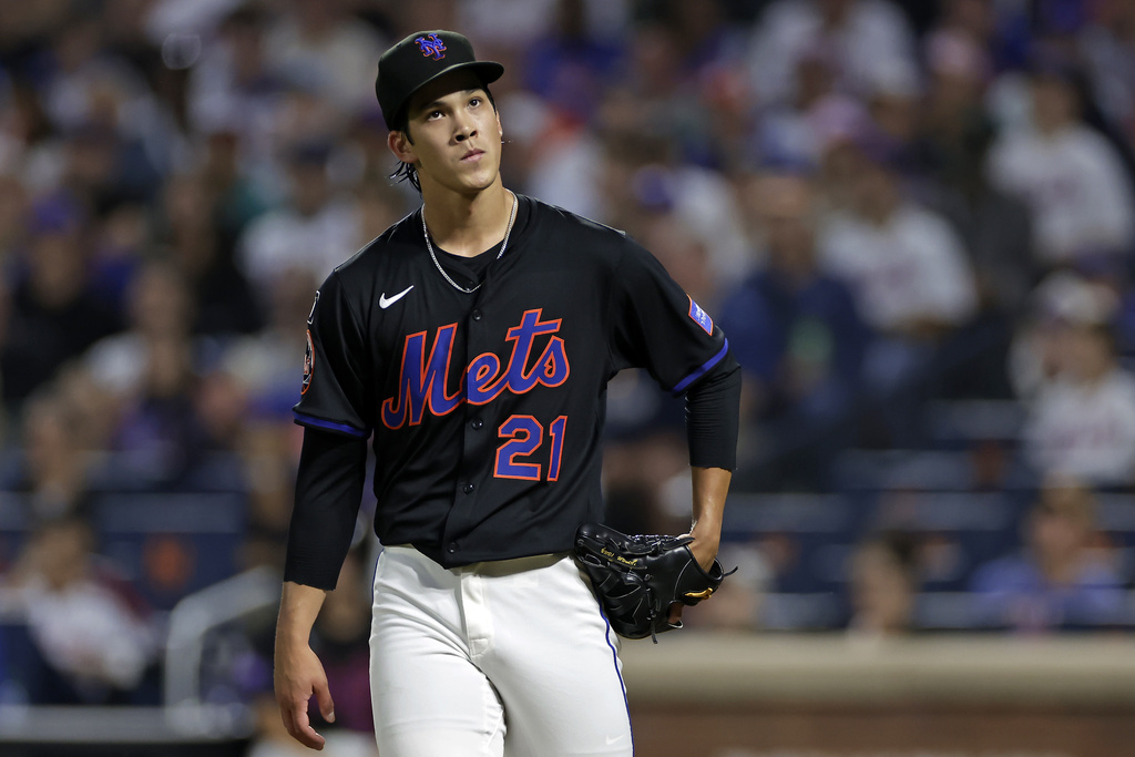 New York Mets pitcher Jonah Tong reacts during the first inning of a baseball game against the Texas Rangers, Friday, Sept. 12, 2025, in New York. (AP Photo/Adam Hunger)