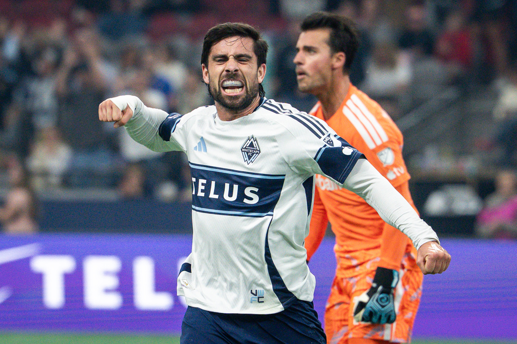 Vancouver Whitecaps' Brian White (24) celebrates his goal against Los Angeles Galaxy during the first half of an MLS soccer match in Vancouver on Wednesday, Sept. 9, 2026. (Ethan Cairns/The Canadian Press via AP)