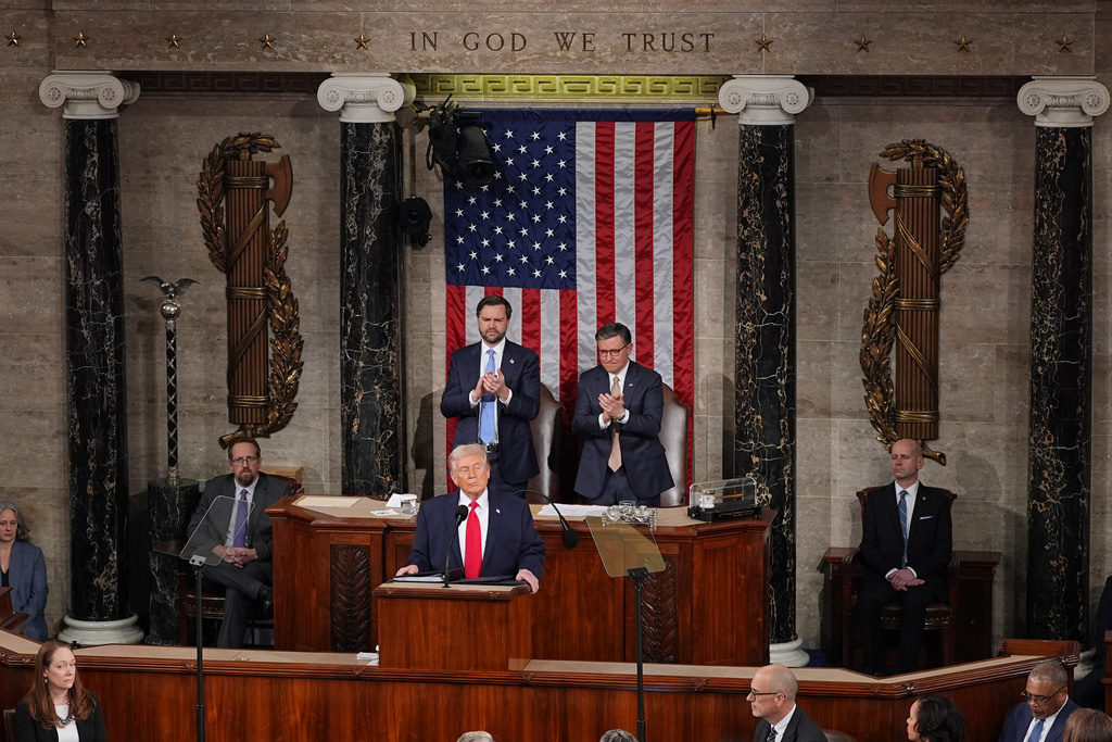 President Donald Trump delivers the State of the Union address to a joint session of Congress in the House chamber at the U.S. Capitol in Washington, Tuesday, Feb. 24, 2026, as Vice President JD Vance and House Speaker Mike Johnson of La., listen. (AP Photo/Matt Rourke)