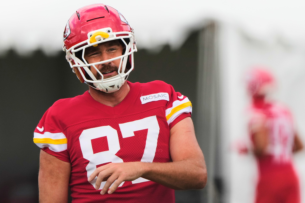 Kansas City Chiefs tight end Travis Kelce talks with a teammate during NFL football training camp Saturday, Aug. 1, 2026, in St. Joseph, Mo. (AP Photo/Charlie Riedel)