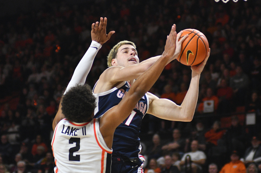 Gonzaga guard Tyon Grant-Foster (7) shoots over Oregon State guard Josiah Lake II (2) during an NCAA college basketball game Saturday, Feb. 7, 2026, in Corvallis, Ore. (AP Photo/Mark Ylen)