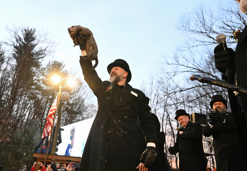 FILE - Groundhog Club handler A.J. Dereume holds Punxsutawney Phil, the weather prognosticating groundhog, during the 139th celebration of Groundhog Day on Gobbler's Knob in Punxsutawney, Pa., Feb. 2, 2025. (AP Photo/Barry Reeger, File)