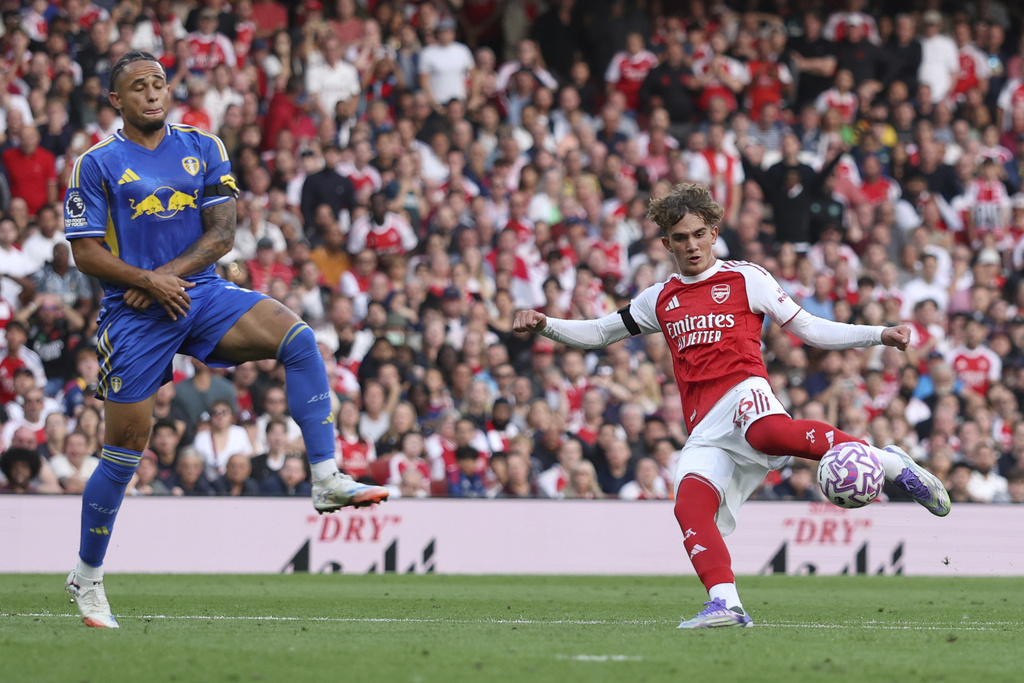 Leeds United's Noah Okafor tries to block a shot from Arsenal's Max Dowman during the English Premier League soccer match between Arsenal and Leeds United at Emirates stadium in London, England, Saturday, Aug. 23, 2025. (AP Photo/Ian Walton)