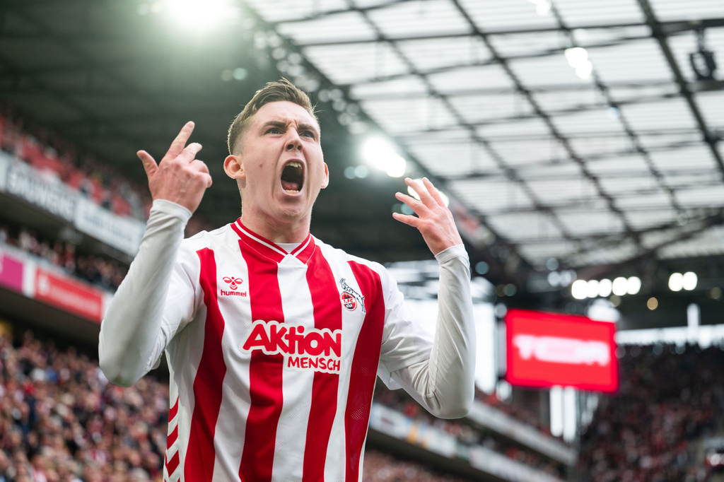 Koln's Isak Johannesson celebrates after scoring his side's third goal during German Bundesliga soccer match between 1. FC Koln and Werder Bremen and Werder Bremen, in Cologne, Germany, Sunday, April 12, 2026. (Marius Becker/dpa via AP)