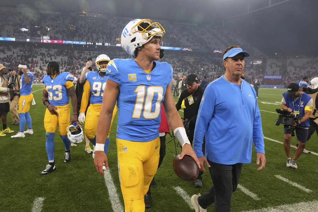 Los Angeles Chargers quarterback Justin Herbert leaves the field after an NFL football game between the Kansas City Chiefs and the Los Angeles Chargers, Saturday, Sept. 6, 2025, in Sao Paulo. (AP Photo/Fernando Llano)