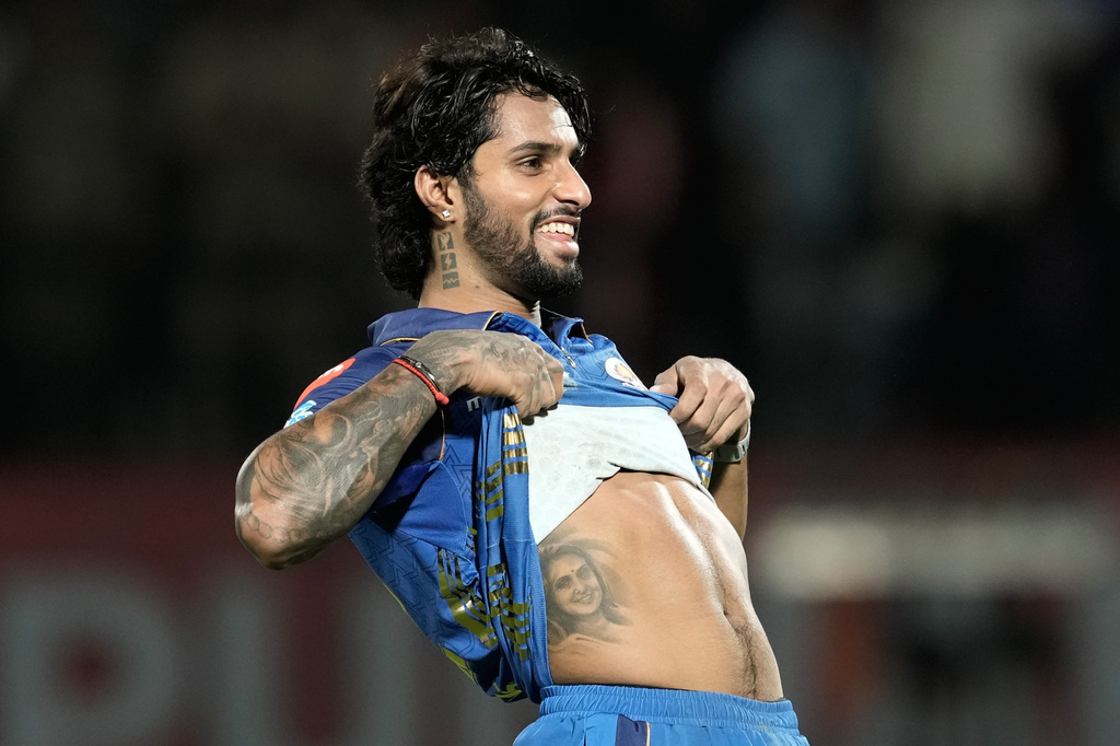 Mumbai Indians' Tilak Varma celebrates after their win in the Indian Premier League cricket match against Punjab Kings in Dharamshala, India, Thursday, May 14, 2026. (AP Photo/Ashwini Bhatia)