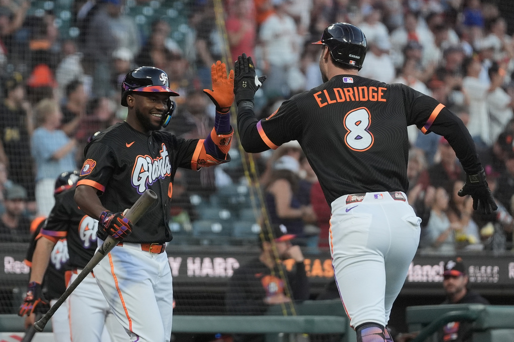 San Francisco Giants' Bryce Eldridge (8) is congratulated by Osleivis Basabe after hitting a home run during the first inning of a baseball game against the St. Louis Cardinals, Tuesday, Sept. 8, 2026, in San Francisco. (AP Photo/Jeff Chiu)