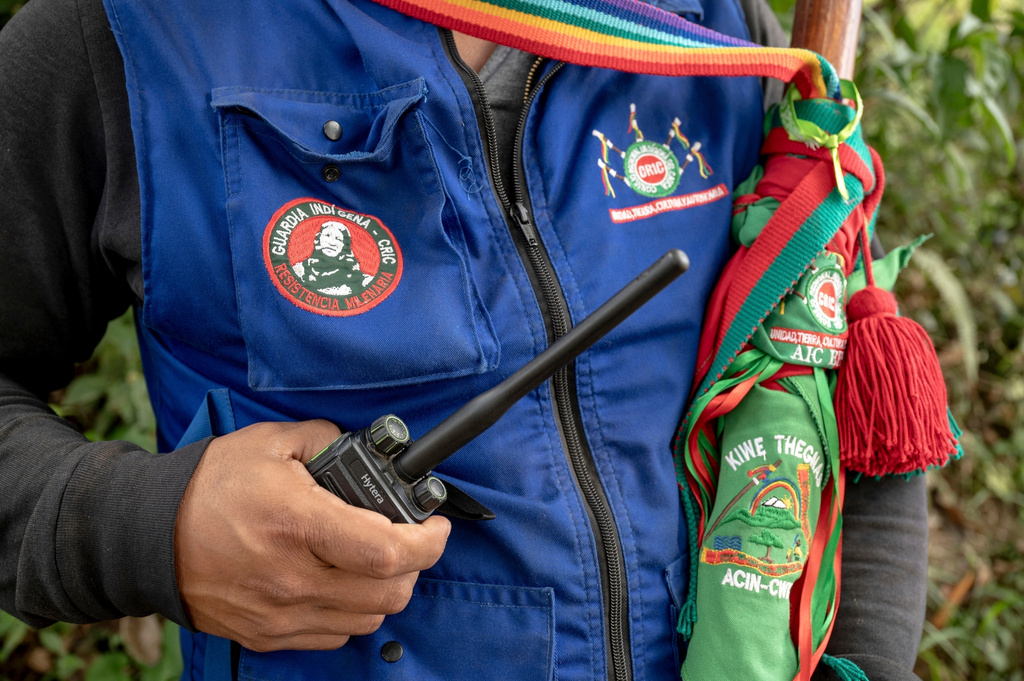 FILE - Eduwin Calambas Fernandez, coordinator of Kiwe Thegnas, which refers to Indigenous Guard in the Nasa Yuwe language, in Canoas, an Indigenous reserve in northern Cauca, Colombia, poses for a photo on July 15, 2025. (AP Photo/Nadège Mazars, File)