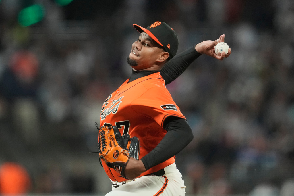 San Francisco Giants pitcher Yunior Marte throws against the Los Angeles Dodgers during the first inning of a baseball game, Friday, Sept. 25, 2026, in San Francisco. (AP Photo/Jeff Chiu)