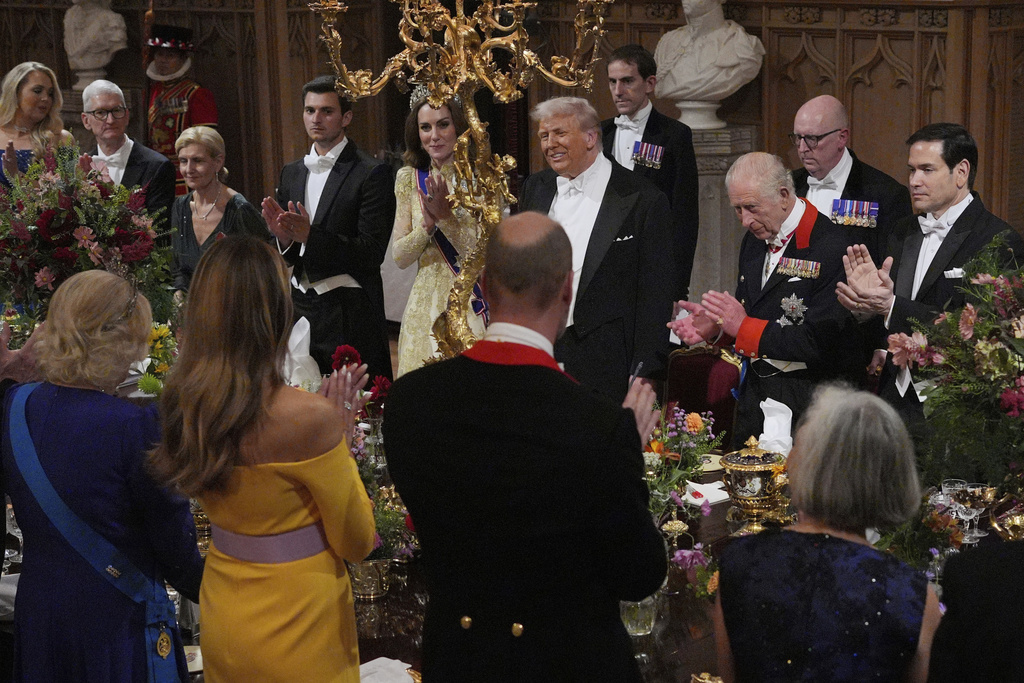 U.S. President Donald Trump, alongside Britain's King Charles, Kate, Princess of Wales, U.S. Secretary of State Marco Rubio and guests attend the State Banquet in Windsor Castle, England, on day one of U.S. President Donald Trump and First Lady Melania Trump's second state visit to the UK, Wednesday Sept. 17, 2025. (Yui Mok/PA via AP, Pool Photo via AP)