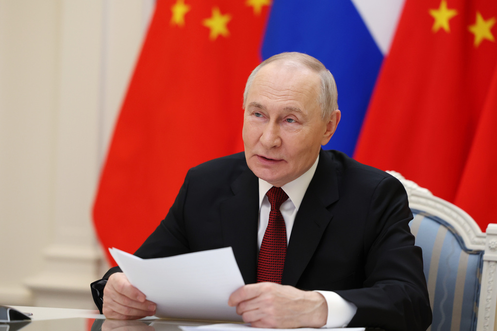 Russian President Vladimir Putin speaks with Chinese President Xi Jinping via videoconference at the Kremlin in Moscow, Wednesday, Feb. 4, 2026. (Vyacheslav Prokofyev/Sputnik, Kremlin Pool Photo via AP)