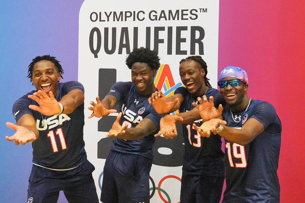 Isaiah Calhoun, Justin McMullen, Velton Brown and Shawn Theard of Team USA posing during the media day ahead of the Flag Football World Championships, the sports first Olympic qualifier for LA28, in Duesseldorf, Germany, Wednesday, Aug. 12, 2026. (AP Photo/Martin Meissner)