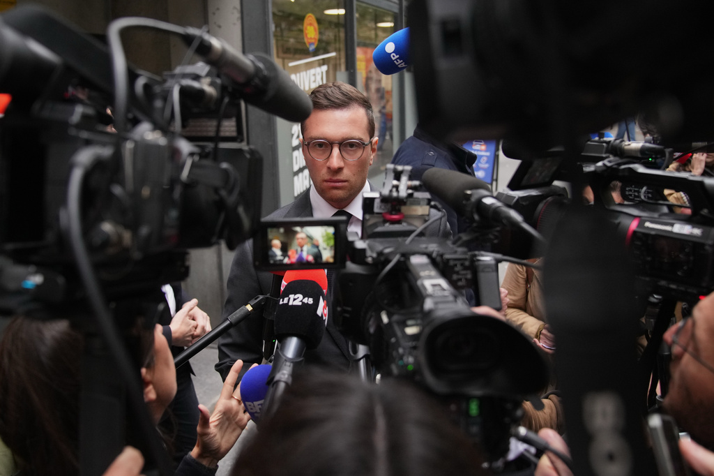 FILE - French far right National Rally party president Jordan Bardella answers reporters following a meeting, on Monday, Oct. 6, 2025 in Paris. (AP Photo/Christophe Ena, File)