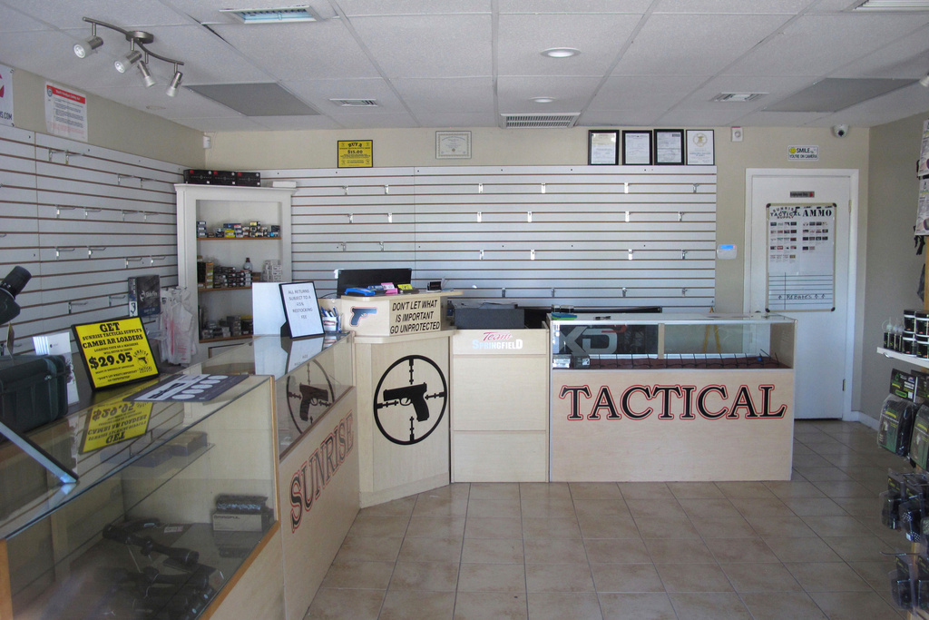 FILE - The walls and cases sit empty at Sunrise Tactical Supply gun shop in Coral Springs, Fla., Feb. 15, 2018. (AP Photo/Allen G. Breed, File)