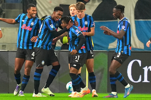 Atalanta's Ademola Lookman, center, celebrates scoring during the Serie A soccer match between Atalanta and AC Milan in Bergamo, Italy, Tuesday, Oct. 28, 2025. (Spada/LaPresse via AP) Atalanta's Ademola Lookman, center, celebrates scoring during the Serie A soccer match between Atalanta and AC Milan in Bergamo, Italy, Tuesday, Oct. 28, 2025. (Spada/LaPresse via AP)