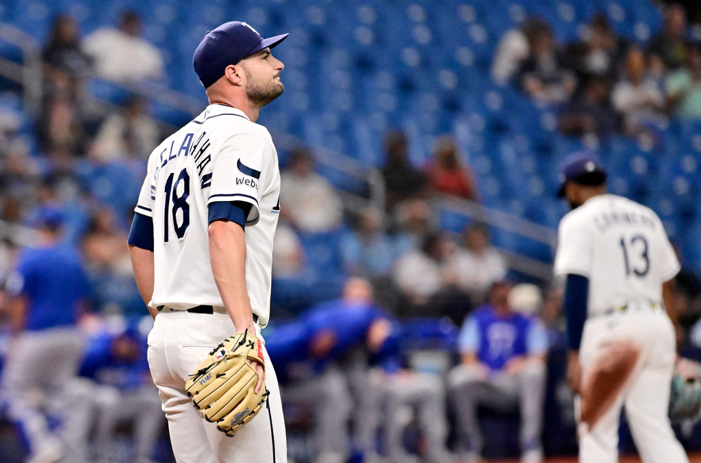 Tampa Bay Rays pitcher Shane McClanahan (18) reacts after giving up a two-run home run to Kansas City Royals' Jac Caglianone, not pictured, during the fifth inning of a baseball game Tuesday, June 23, 2026, in St. Petersburg, Fla. (AP Photo/Jason Behnken)