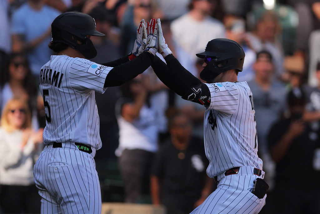 Chicago White Sox's Brenton Doyle, right, celebrates after his two-run home run with Munetaka Murakami, left, during the third inning of a baseball game against the Colorado Rockies, Sunday, Sept. 27, 2026, in Chicago. (AP Photo/Melissa Tamez)