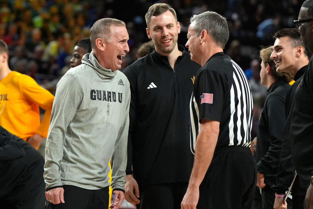 Arizona State head coach Bobby Hurley talks with a referee during the first half of an NCAA college basketball game against Kansas, Tuesday, March 3, 2026, in Tempe, Ariz. (AP Photo/Rick Scuteri)