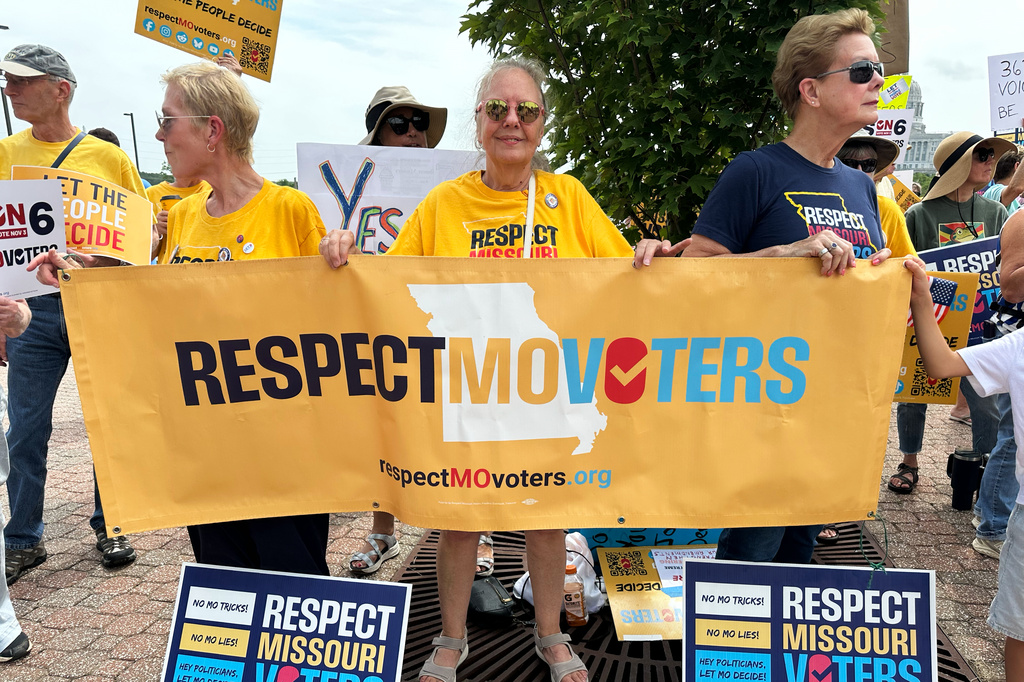 Activists with the group Respect Missouri Voters rally in support of a proposed constitutional amendment near the state Capitol in Jefferson City, Mo., Friday, Aug. 7, 2026. (AP Photo/David A. Lieb)