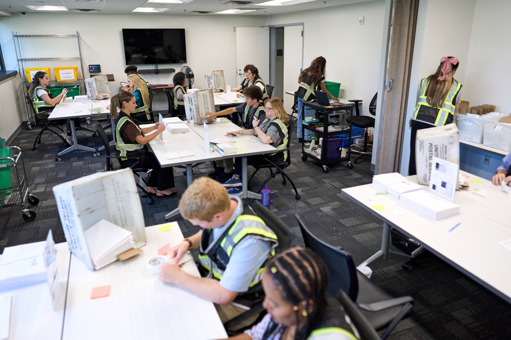 Wake County Board of Elections employees prepare absentee ballots to be mailed on Thursday, Sept. 3, 2026, in Raleigh, N.C. (AP Photo/Matt Ramey)