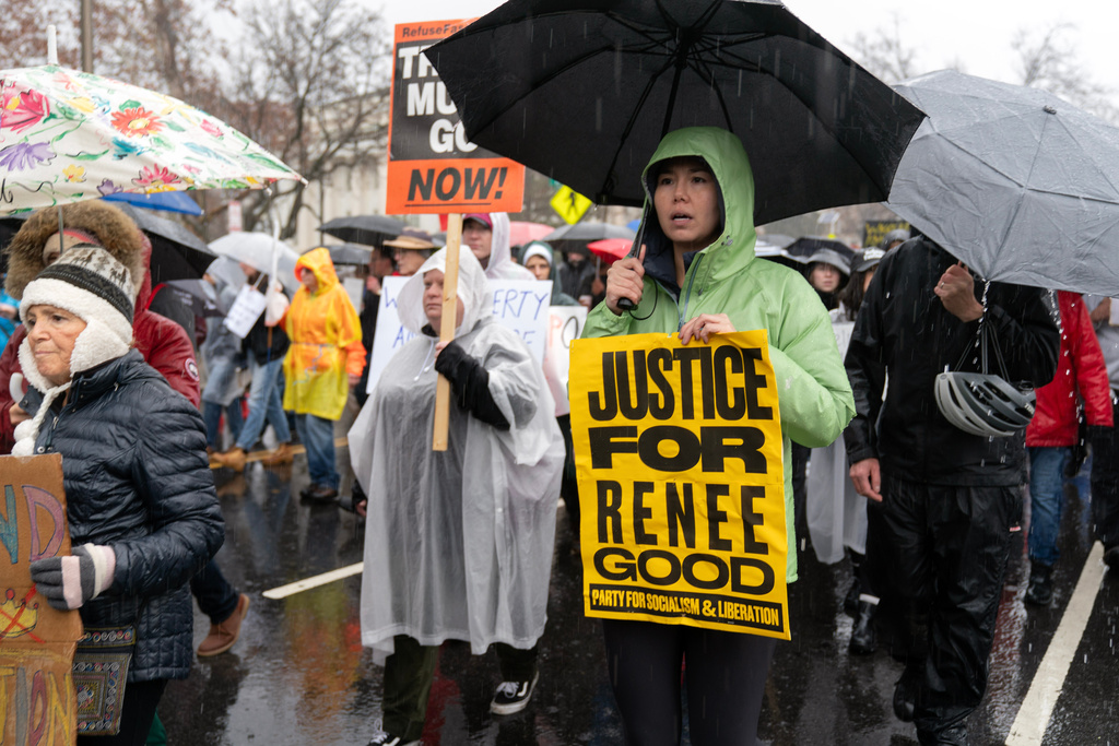 Demonstrators march outside the White House in Washington, Saturday, Jan. 10, 2026, against the Immigration and Customs Enforcement agent who fatally shot Renee Good in Minneapolis. (AP Photo/Jose Luis Magana)