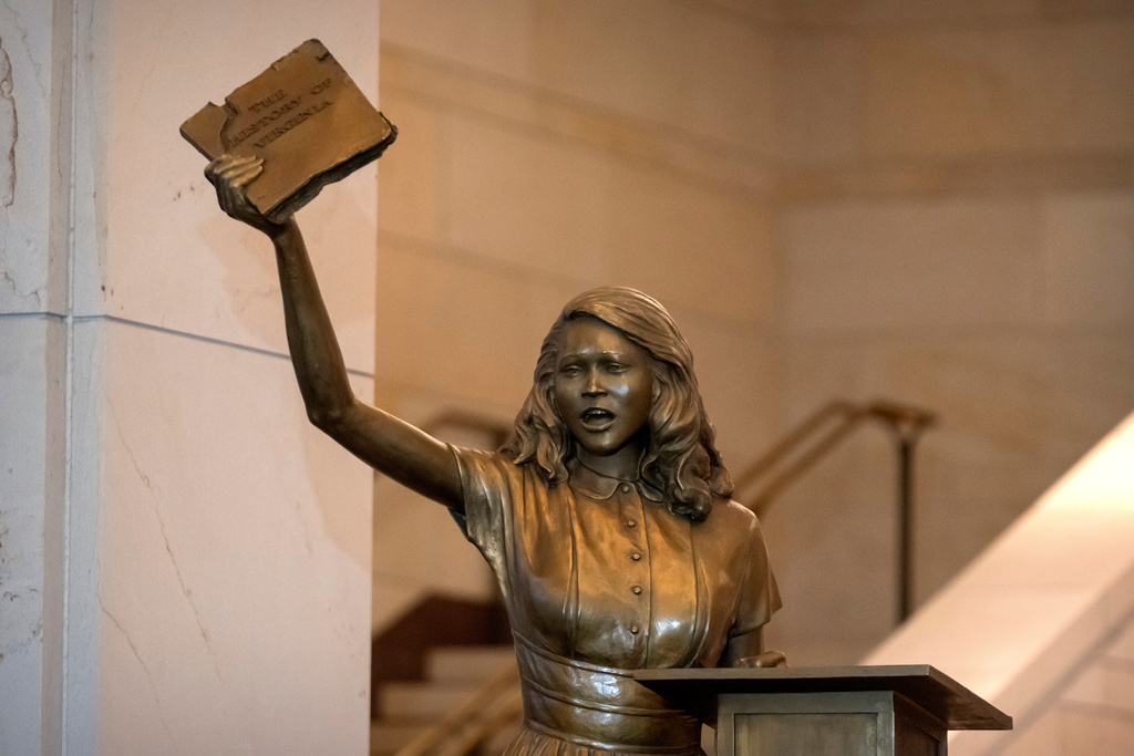 A statue of Virginia civil rights activist Barbara Rose Johns, whose statue will replace one of Robert E. Lee as one of Virginia's two statues on display at the Capitol, is unveiled Tuesday, Dec. 16, 2025, in Washington. (AP Photo/Mark Schiefelbein)