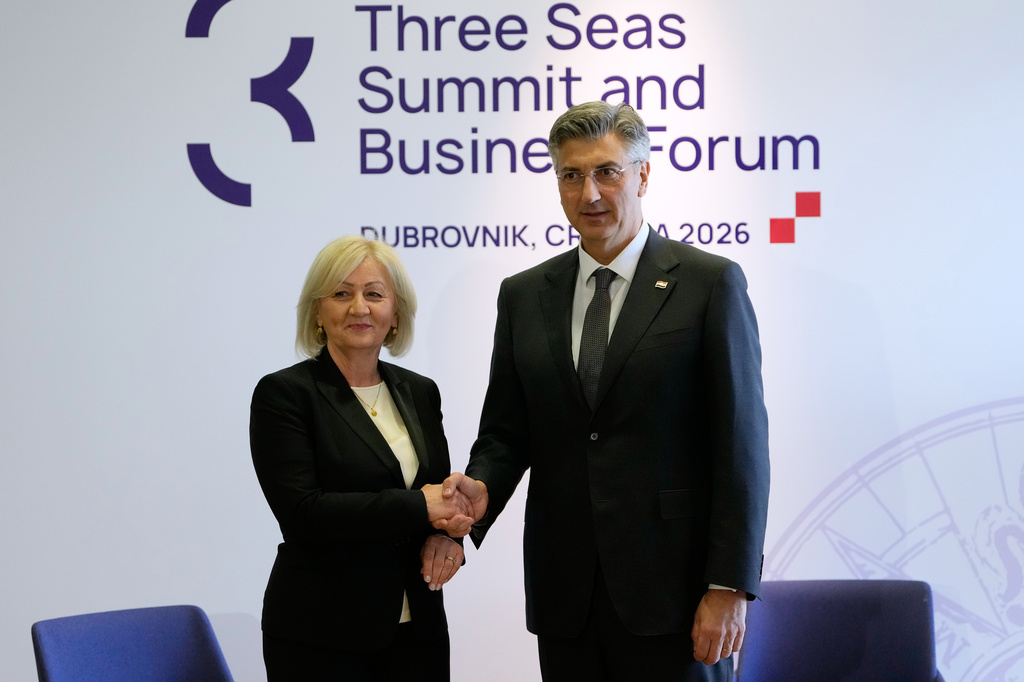 Croatia Prime Minister Andrej Plenkovic, right, welcomes Chairwoman of the Council of Ministers of Bosnia and Herzegovina Borjana Kristo at the Three Seas Initiative summit in Dubrovnik, Croatia, Tuesday, April 28, 2026. (AP Photo/Darko Bandic)