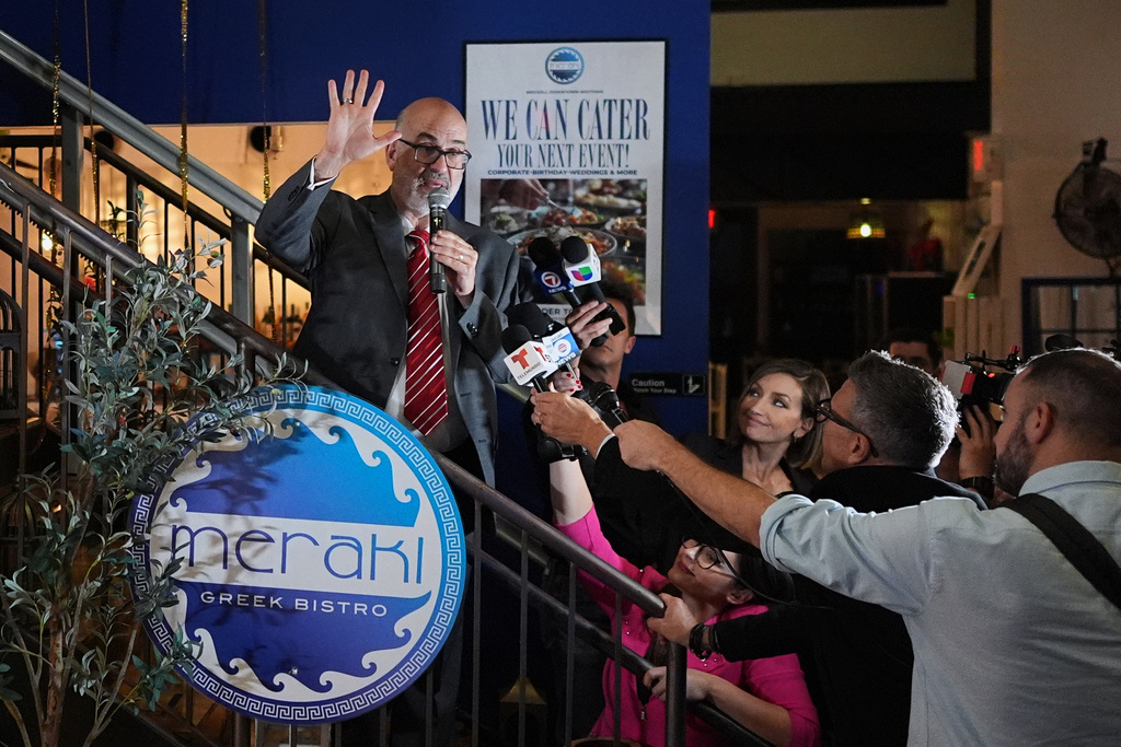 Miami mayor candidate Emilio Gonzalez, a former city manager backed by President Donald Trump, waves as he thanks supporters after conceding to Democrat Eileen Higgins in Miami's mayoral runoff election, at a watch party, in downtown Miami, Tuesday, Dec. 9, 2025. (AP Photo/Rebecca Blackwell)