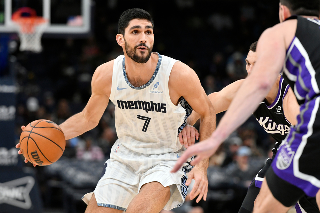 Memphis Grizzlies forward Santi Aldama (7) handles the ball against Sacramento Kings guard Zach LaVine in the first half of an NBA basketball game, Thursday, Nov. 20, 2025, in Memphis, Tenn. (AP Photo/Brandon Dill)