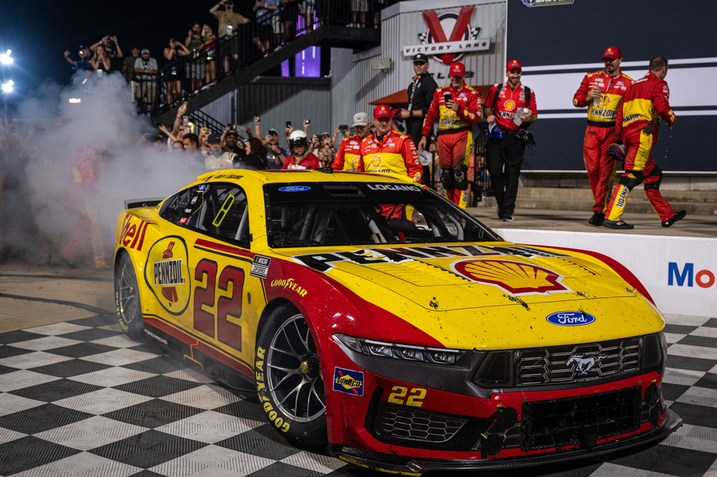 Team Penske driver Joey Logano (22) enters victory lane after winning the Cook Out 400 at Richmond Raceway, Saturday, Aug. 15, 2026, in Richmond Va. (AP Photo/Robert Simmons)