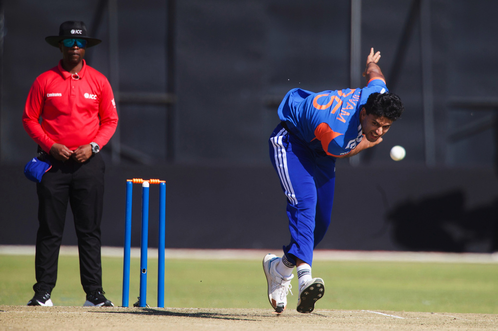 India's bowler Shivam Dube, right, bowls as umpire Iknow Chabi of Zimbabwe, watches on during the first T20 cricket match between Zimbabwe and India in Harare, Zimbabwe, Thursday, July 23, 2026. (AP Photo/Wonder Mashura)