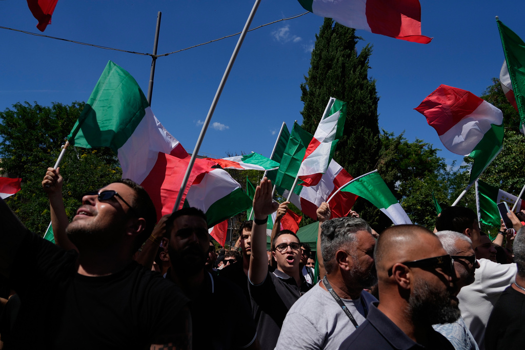 Demonstrators shout slogans as they gather during a protest organized by right-wing groups, calling for the repatriation of migrants, in Rome, Saturday, June 13, 2026. (AP Photo/Gregorio Borgia)
