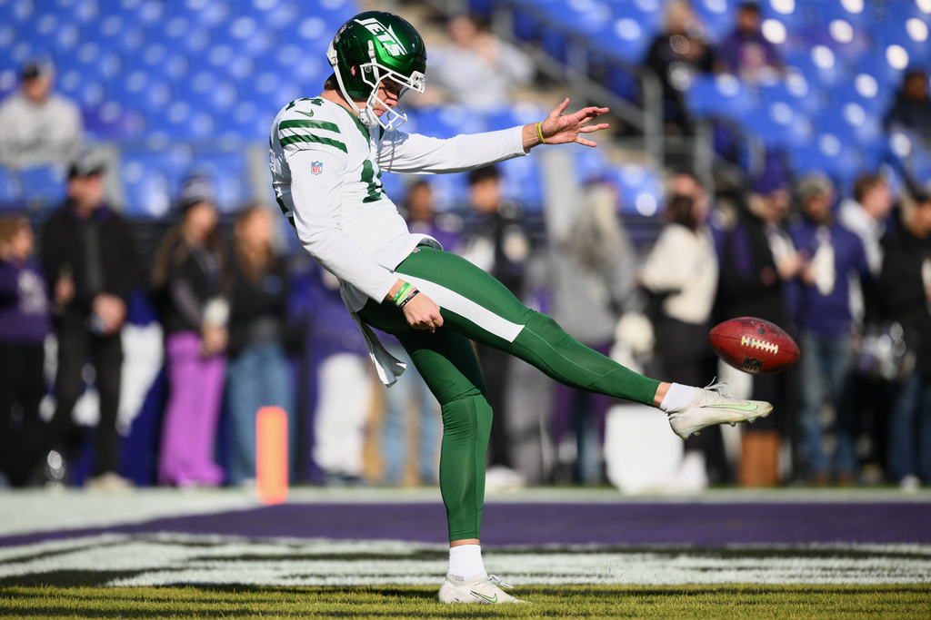 FILE - New York Jets punter Austin McNamara (14) warms up before an NFL football game against the Baltimore Ravens, Nov. 23, 2025, in Baltimore. (AP Photo/Nick Wass, File)