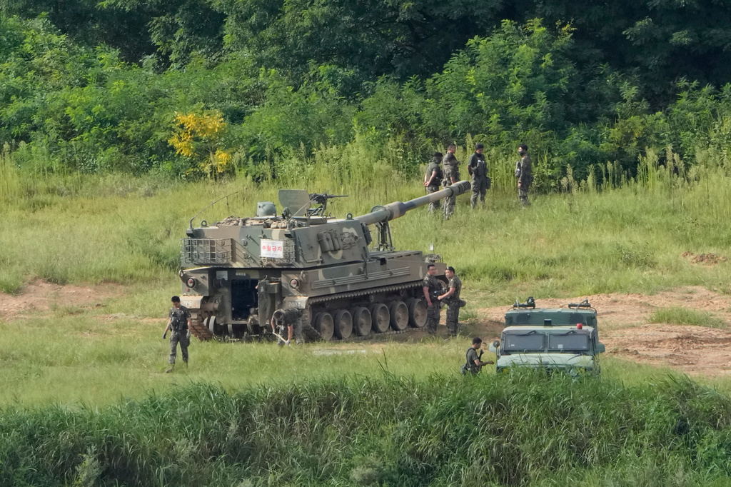 South Korean army soldiers work near their K-9 self-propelled howitzer in Paju, South Korea, near the border with North Korea, Sunday, Sept. 6, 2026. (AP Photo/Ahn Young-joon)