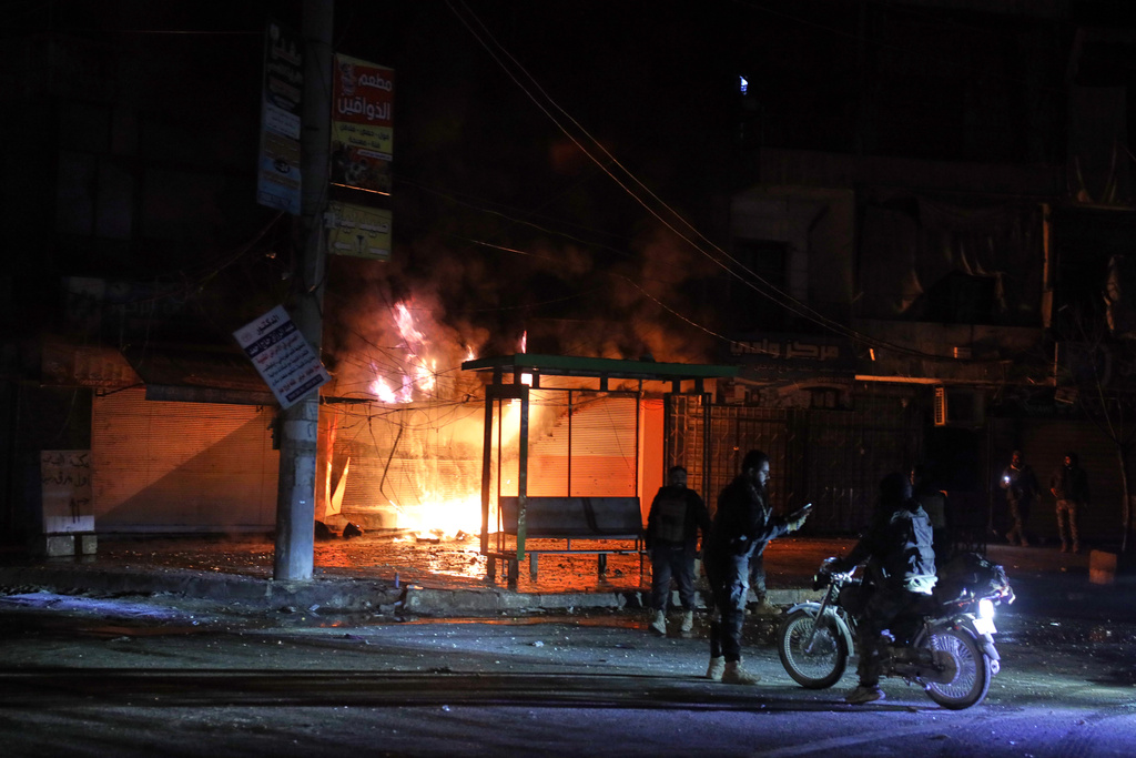 Members of Syrian government forces deploy on the streets as they take over the Achrafieh neighborhood from Kurdish fighters during ongoing clashes that erupted Tuesday in a contested area of the northern city of Aleppo, Syria, Thursday, Jan. 8, 2026. (AP Photo/Omar Albam)