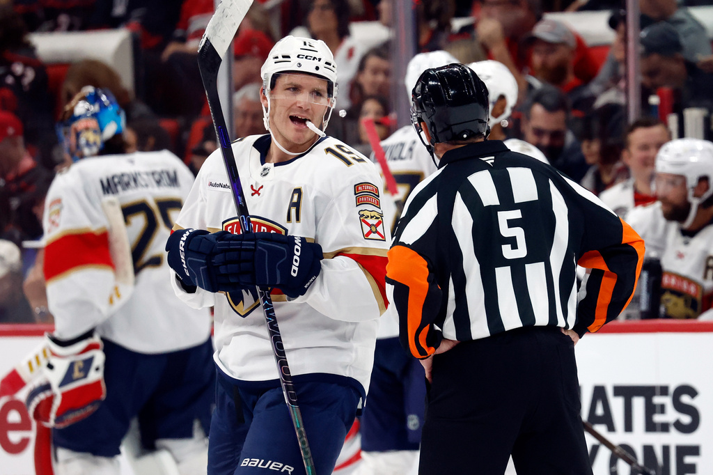 Florida Panthers' Matthew Tkachuk (19) talks with an official during the third period of an NHL hockey game against the Carolina Hurricanes in Raleigh, N.C., Tuesday, Sept. 29, 2026. (AP Photo/Karl DeBlaker)