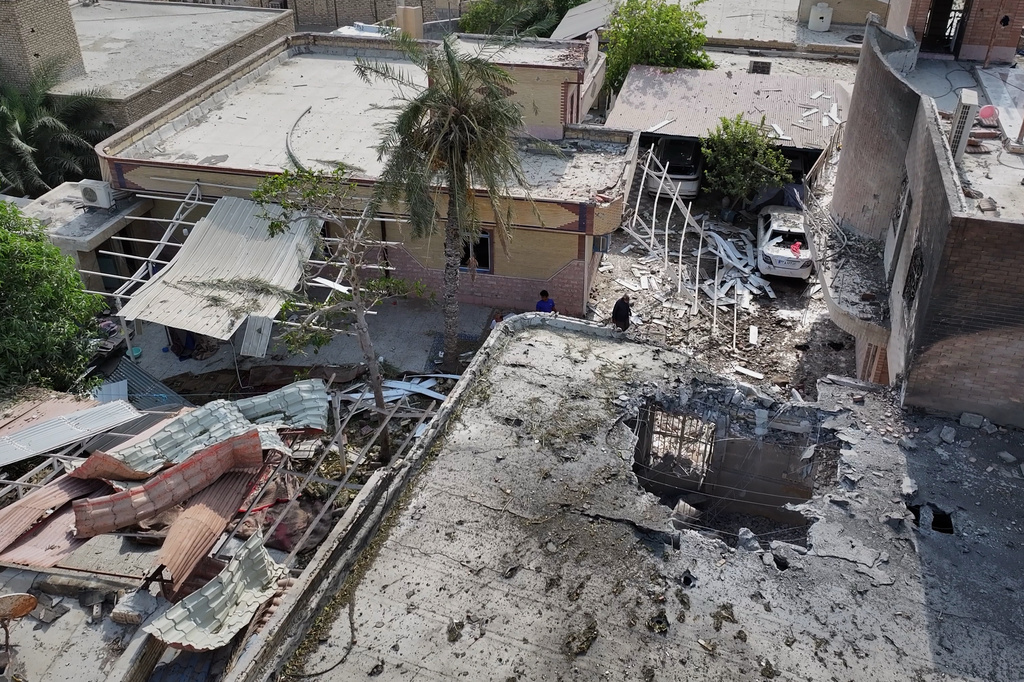 An aerial view shows the apparent point of impact on the roof of a building that Iranian media said was hit by a U.S. strike while a wedding celebration was taking place there, in Kuhestak, southern Iran, Wednesday, Sept. 2, 2026. (Morteza Akhoondi/Tasnim News Agency via AP)