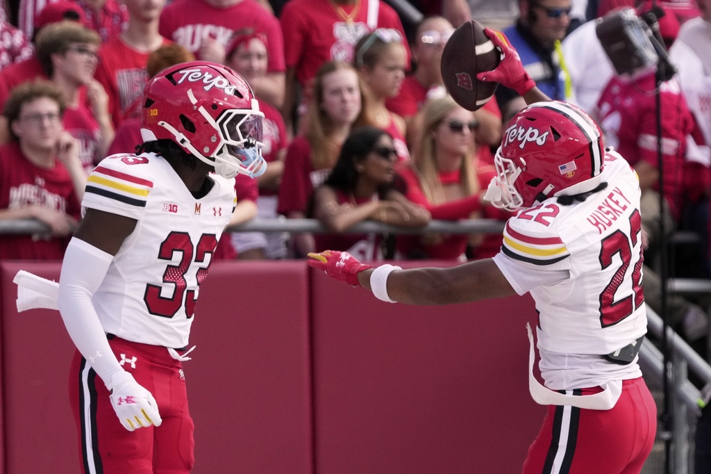 Maryland's Jalen Huskey celebrates his interception with Messiah Delhomme during the first half of an NCAA college football game against Wisconsin Saturday, Sept. 20, 2025, in Madison, Wis. (AP Photo/Morry Gash)
