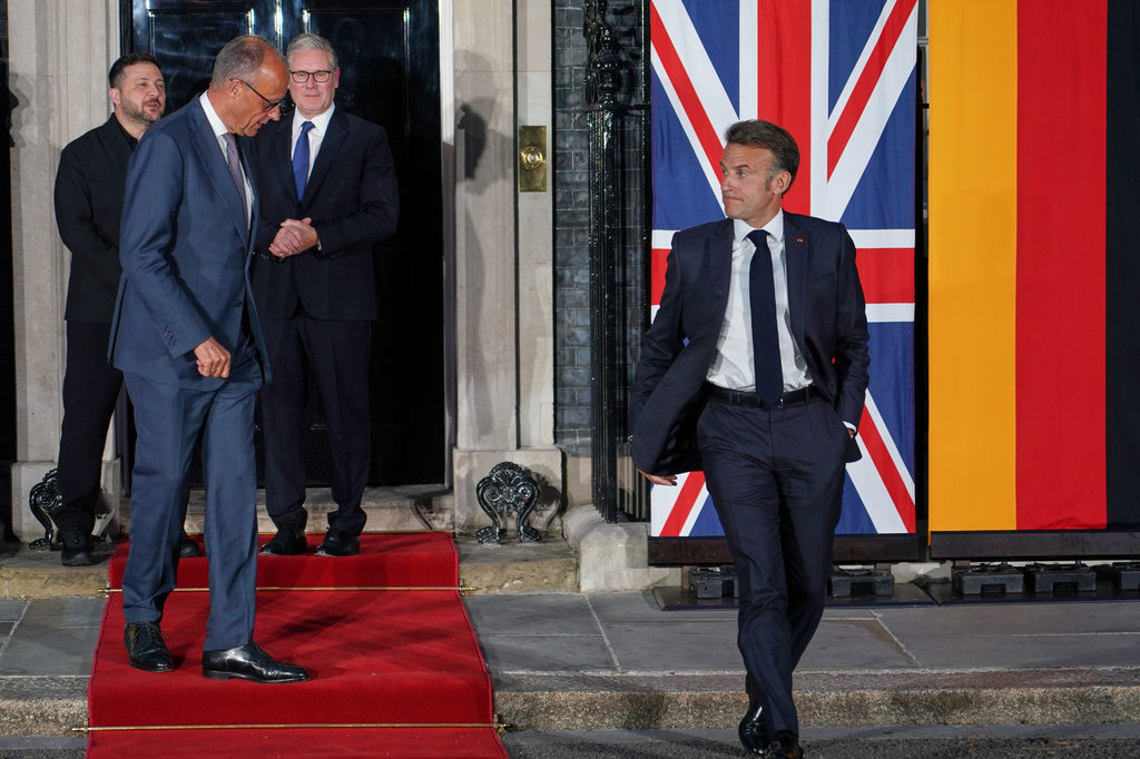 Britain's Prime Minister Keir Starmer, third from left, stands with Ukraine's President Volodymyr Zelenskyy, far left, as France's President Emmanuel Macron, right, and Germany's Chancellor Friedrich Merz leave 10 Downing Street after their meeting in London, Sunday, June 7, 2026. (AP Photo/Alberto Pezzali)