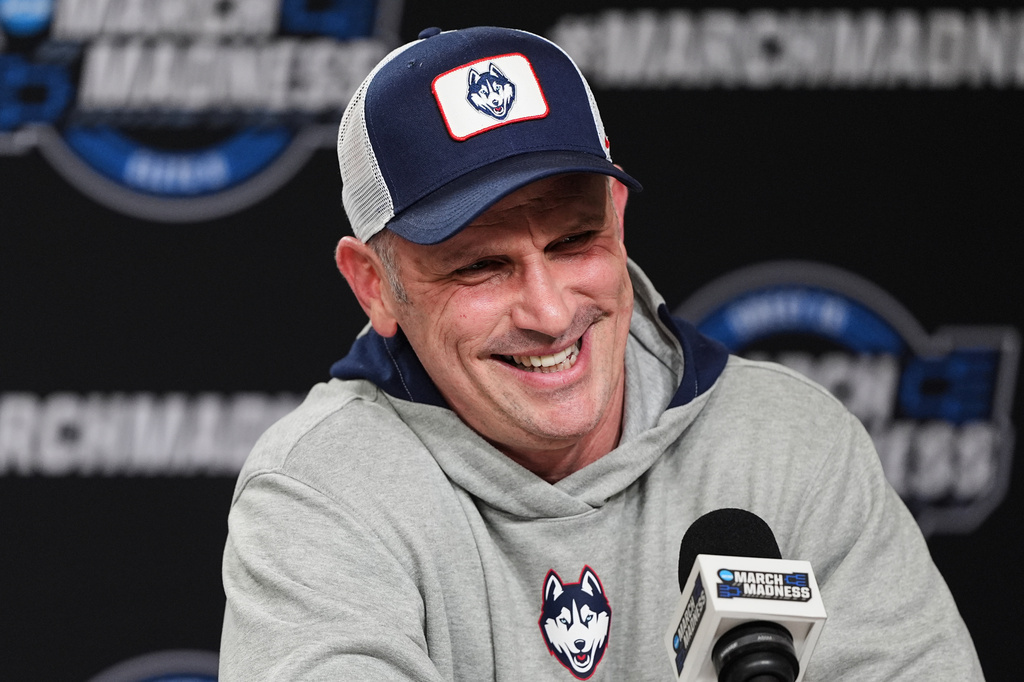 UConn head coach Dan Hurley laughs during a press conference ahead of a game against Duke in the Elite Eight of the NCAA college basketball tournament Saturday, March 28, 2026, in Washington. (AP Photo/Abbie Parr)