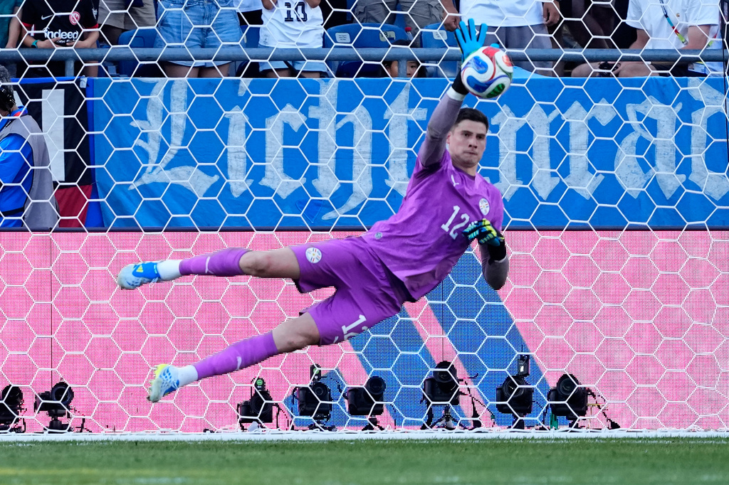 Paraguay goalkeeper Orlando Gill (12) makes a save during a penalty shootout at the end of during the World Cup round of 32 soccer match between Germany and Paraguay in Foxborough, Mass., near Boston, Monday, June 29, 2026. (AP Photo/Petr David Josek)